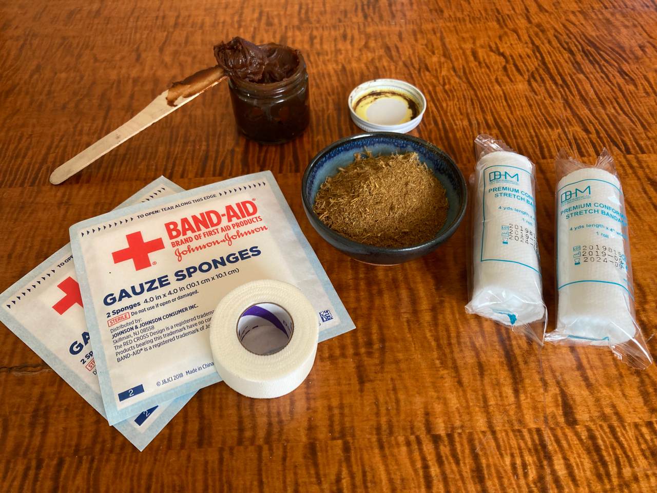 San Huang San first aid supplies — herbal salve, powder, gauze and bandages