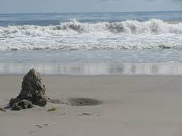Ocean waves on a beach — illustrating the rhythm of breath in meditation